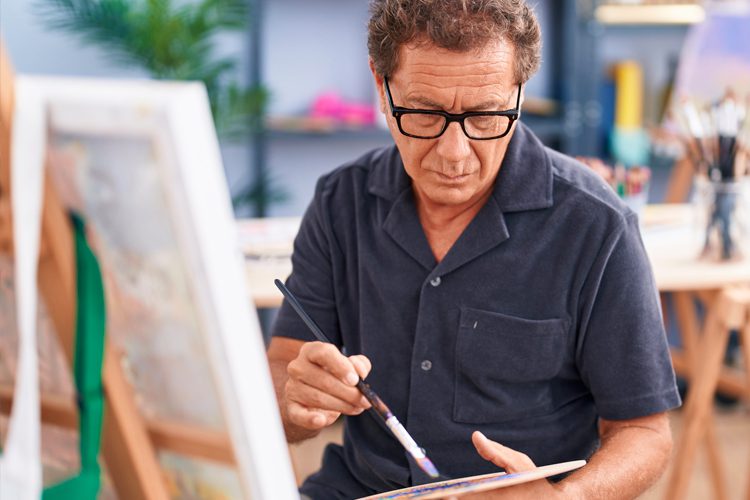 senior man painting