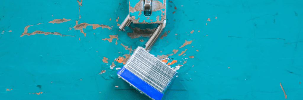 open lock on blue surface