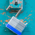 open lock on blue surface