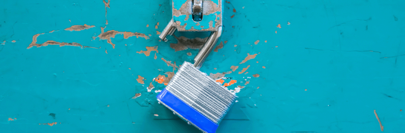 open lock on blue surface