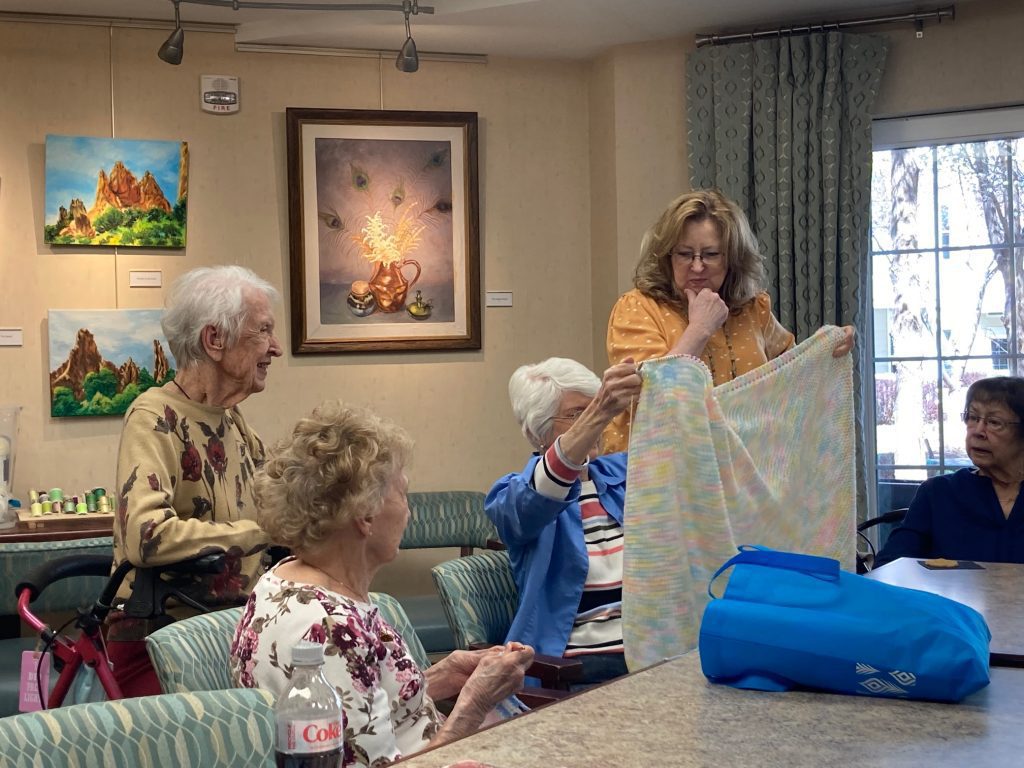 Holly Creek ladies knit to warm babies across the Front Range