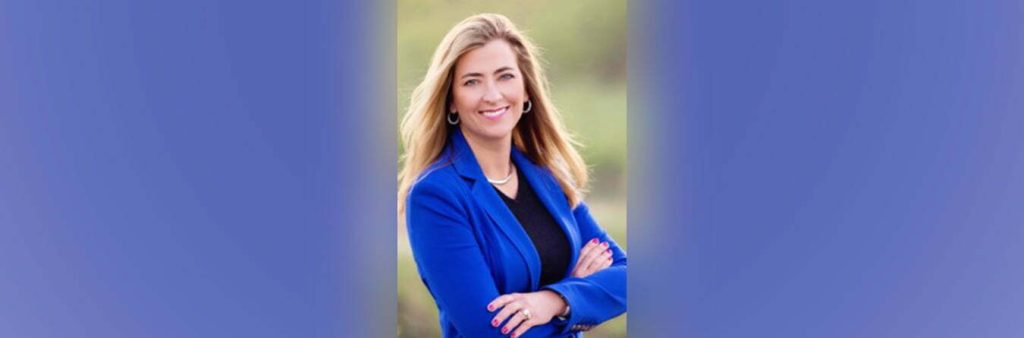 smiling woman in blue suit jacket