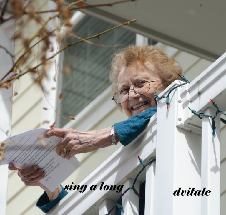 Holly Creek residents participate in the sing-a-long from their balconies.