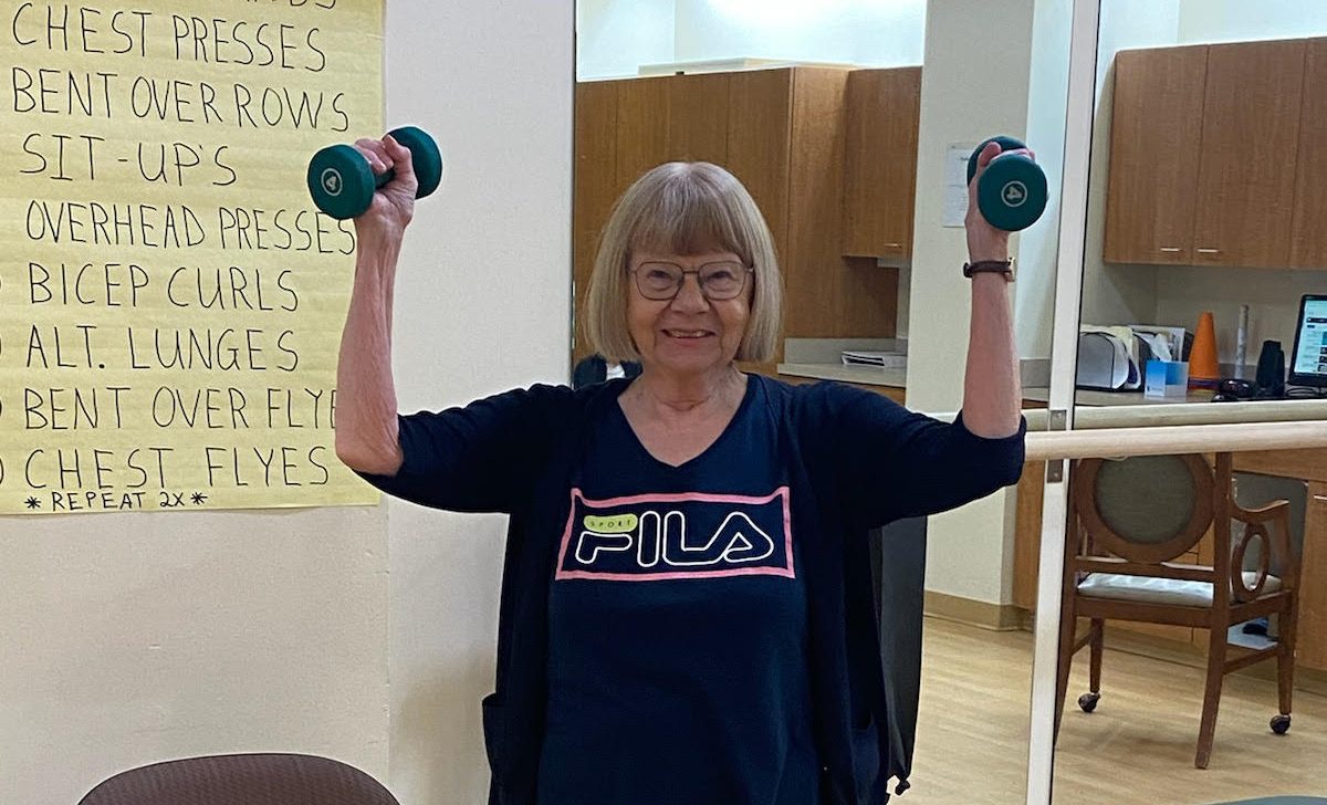 Holly Creek resident lifting weights