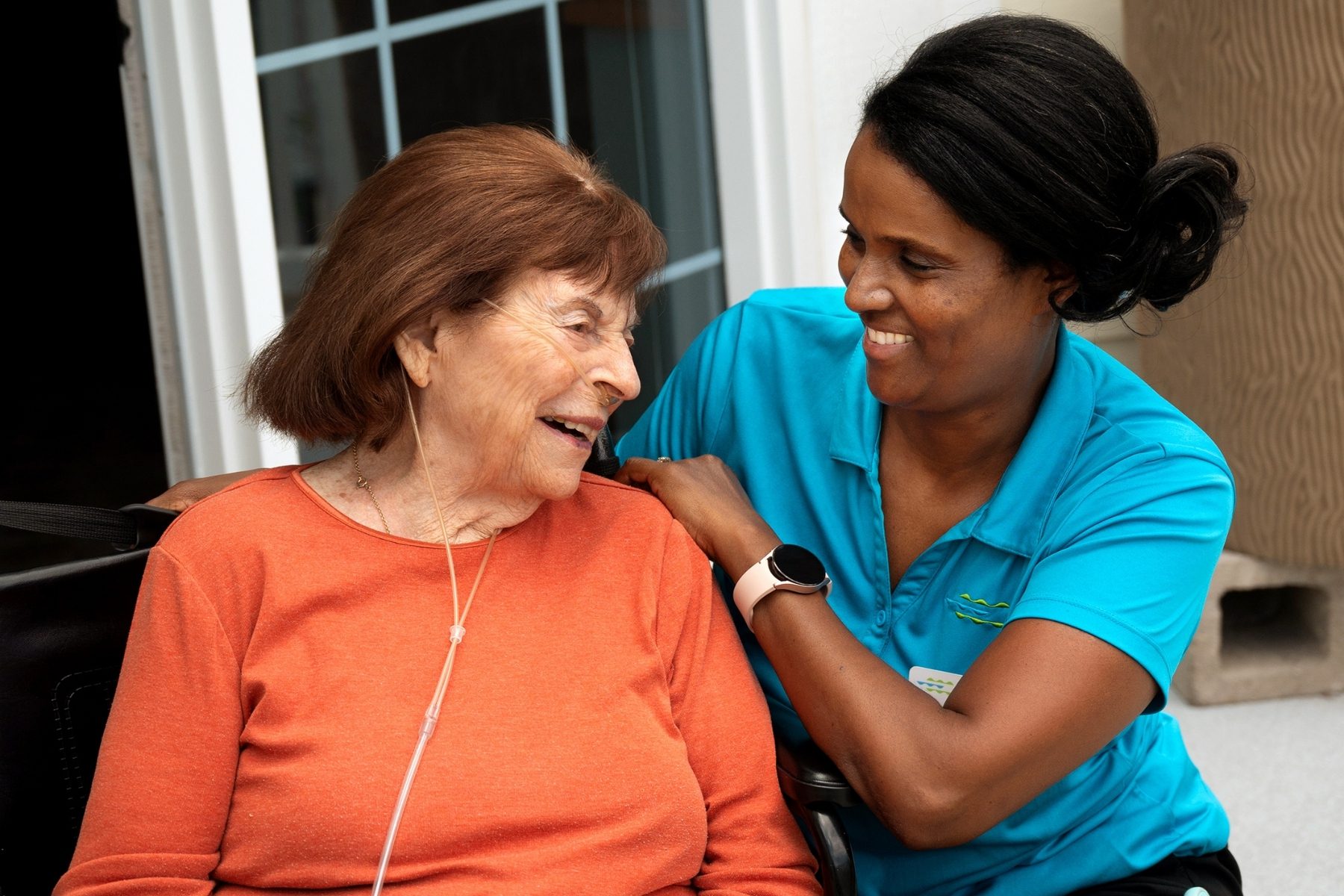 care partner and resident smiling landscape