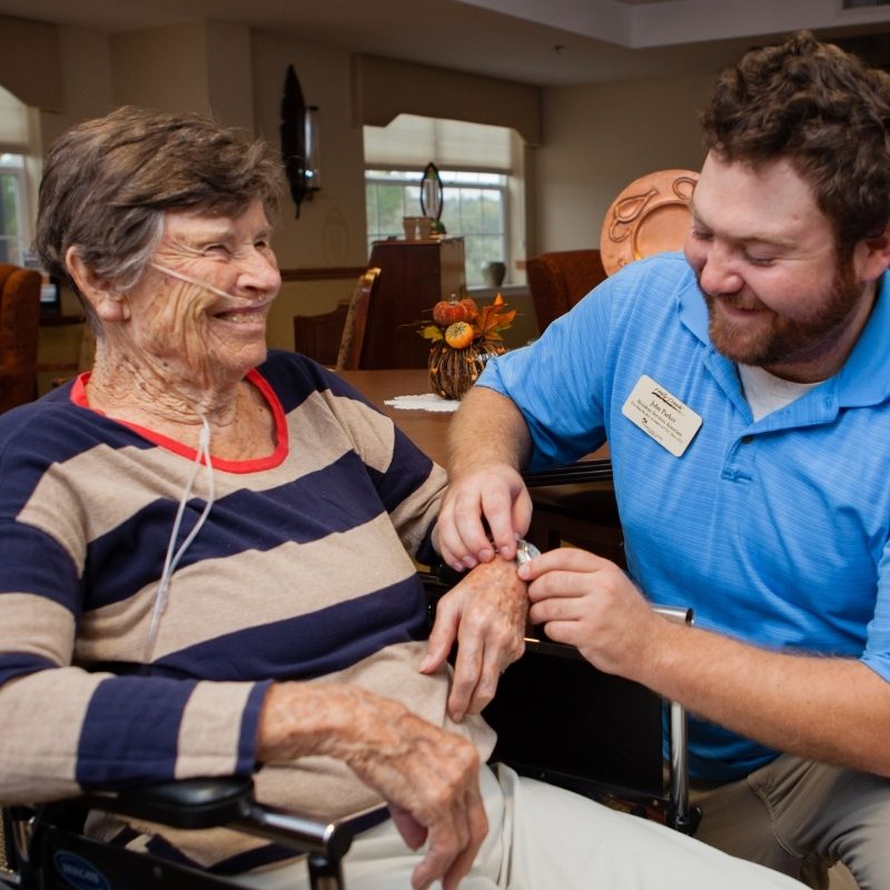 care partner spending time with resident square