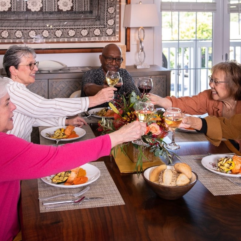 residents dining together cheering square