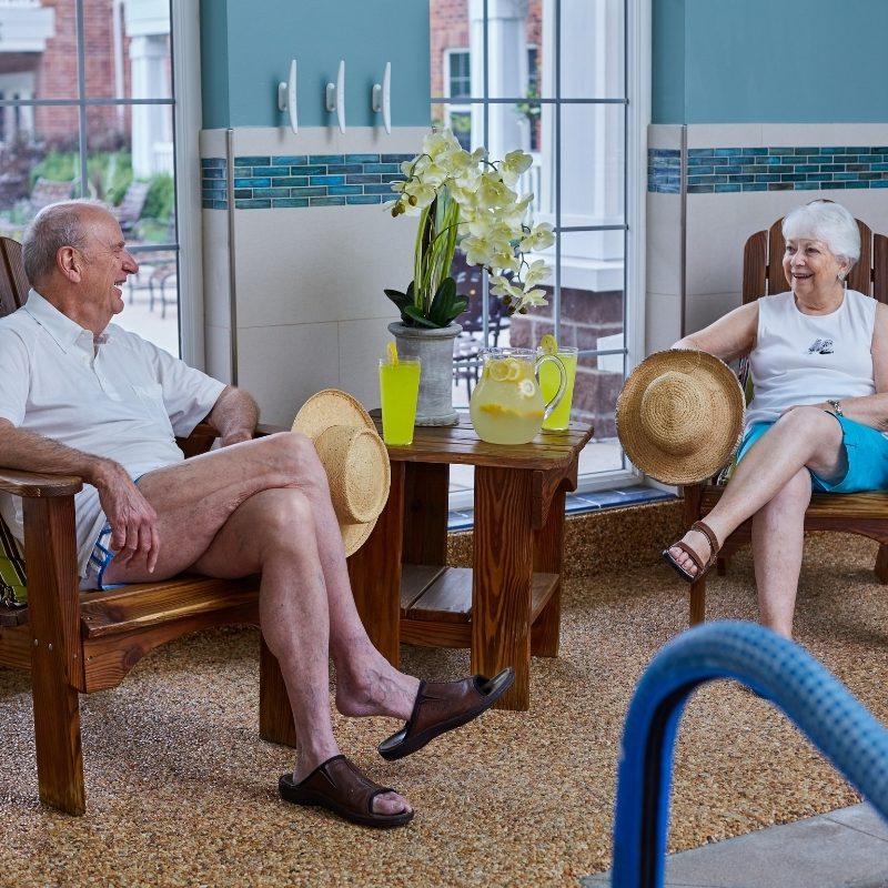 residents lounging near pool square