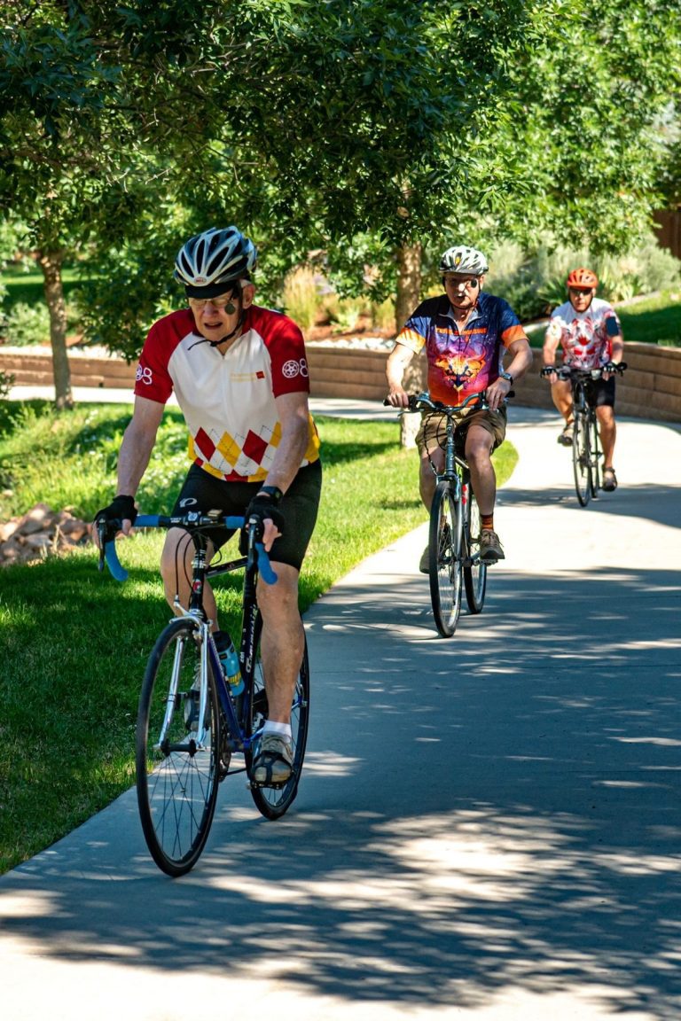 residents riding bikes on trail portrait