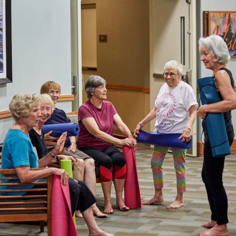 residents socializing in yoga class square