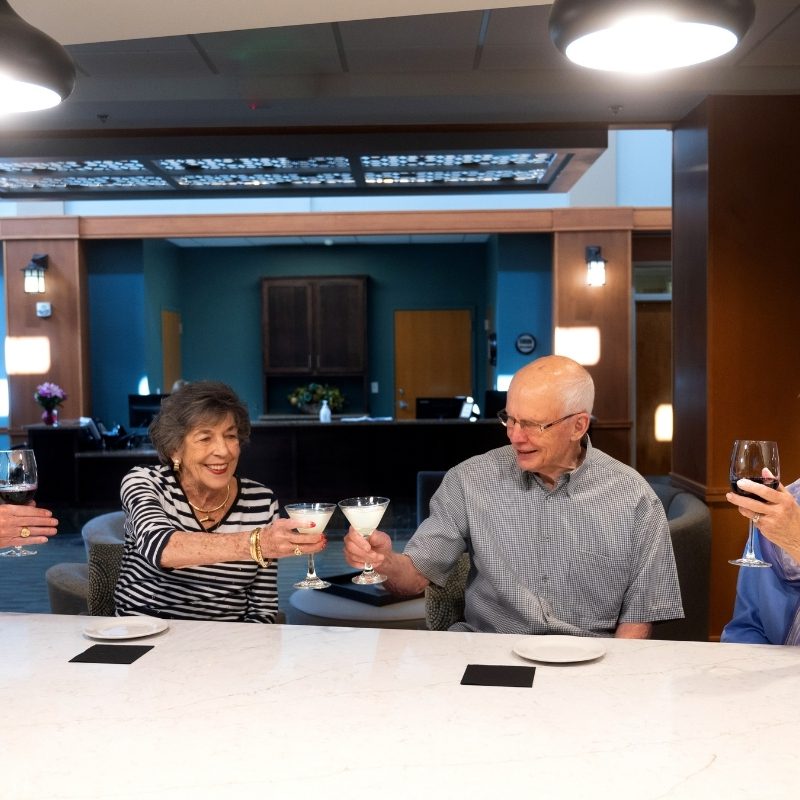 residents with wine glasses square