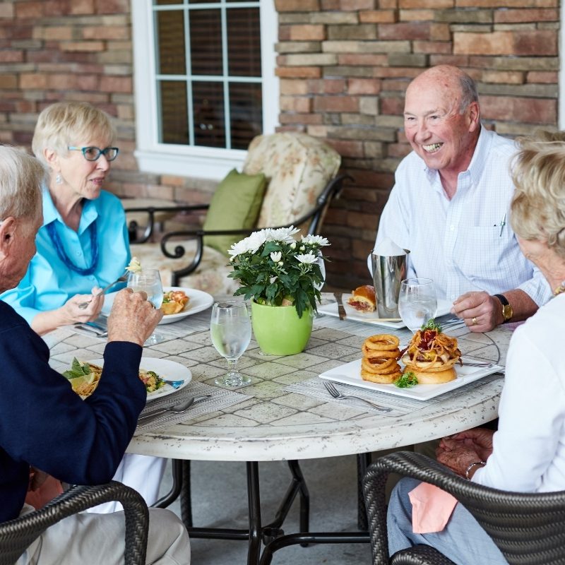 seniors enjoying meal together square