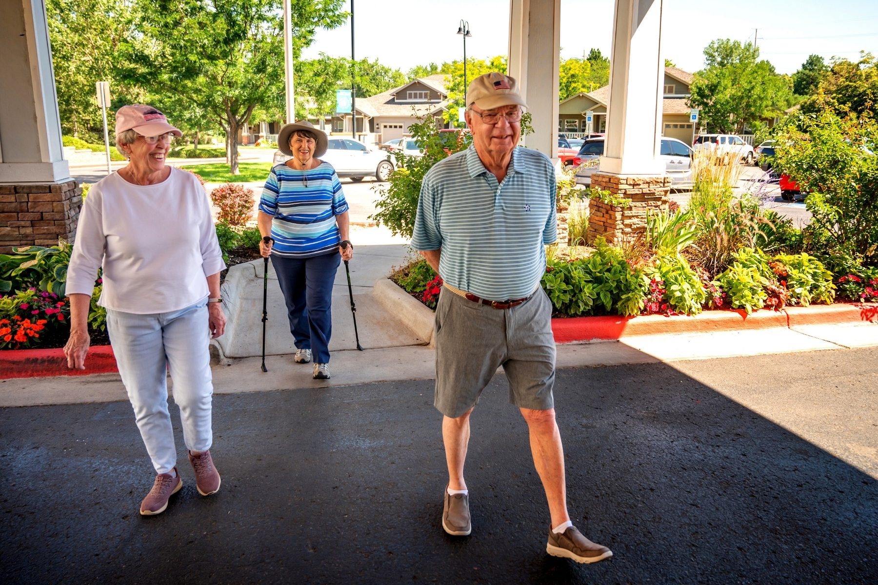 seniors walking into holly creek landscape