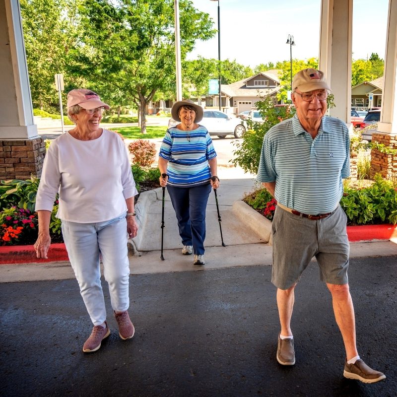 seniors walking into holly creek square