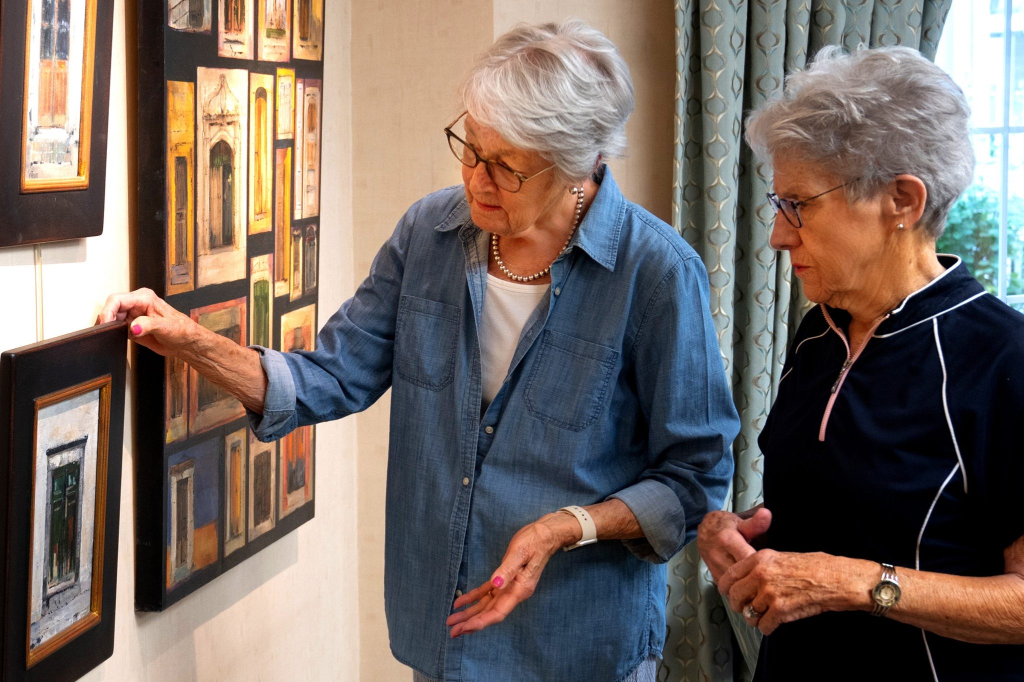 woman looking at art on wall largelandscape