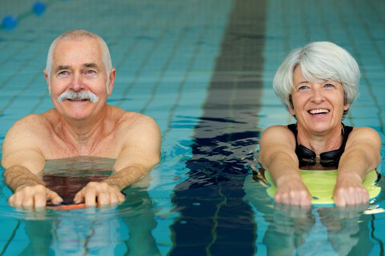 senior couple swimming