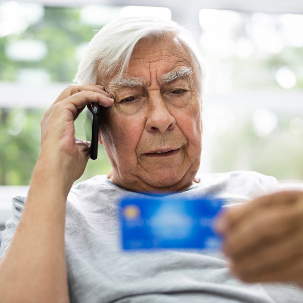 holly creek man addressing credit card fraud on phone