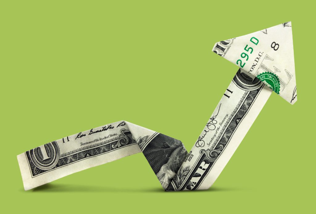 dollar bill folded into arrow