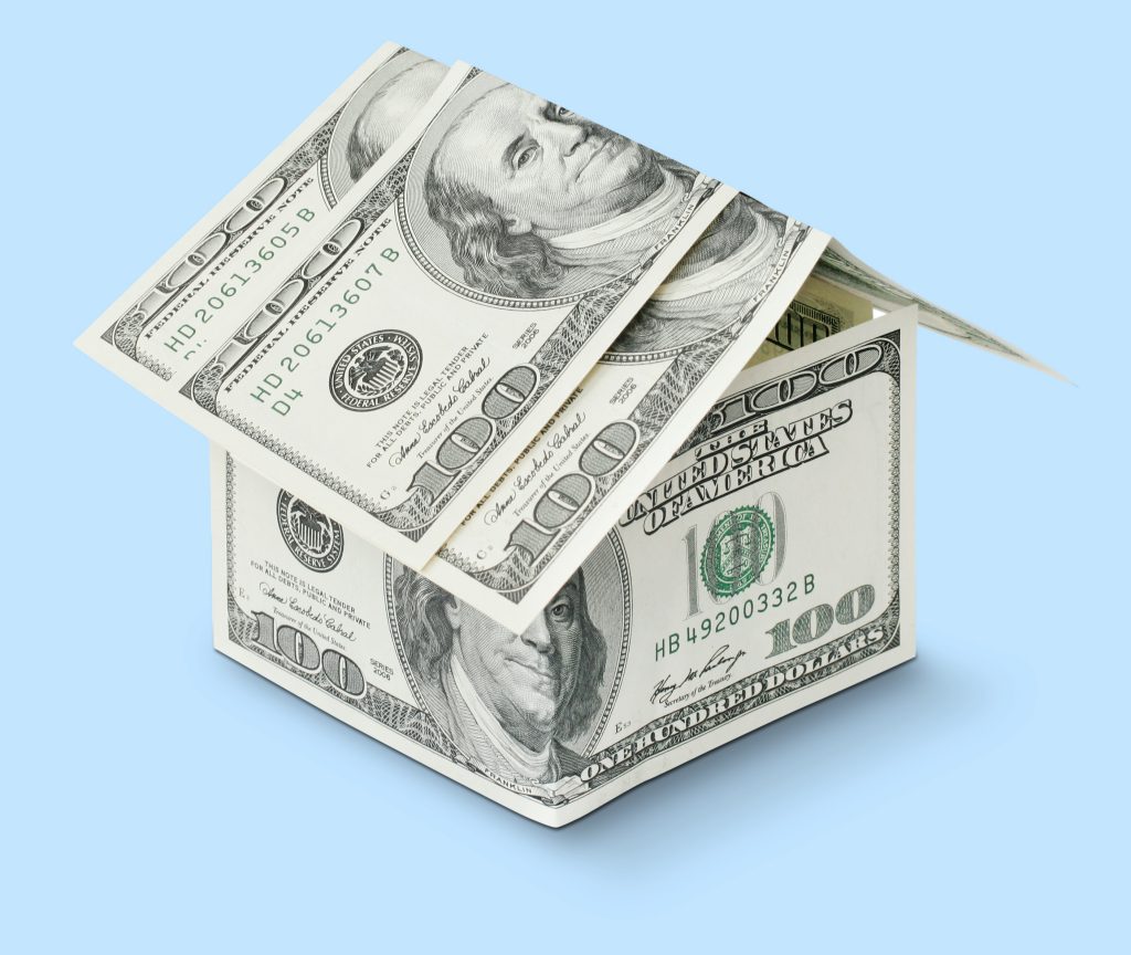 house made of dollar bills with a blue background