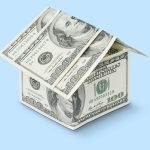 house made of dollar bills with a blue background
