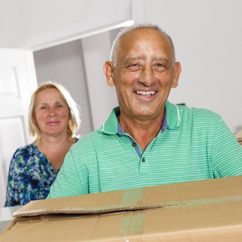 holly creek senior couple with moving boxes