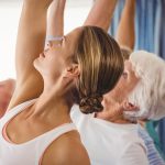hc middle aged woman and senior woman doing exercises