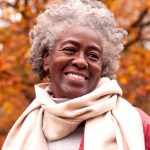 holly creek senior woman smiling in fall weather