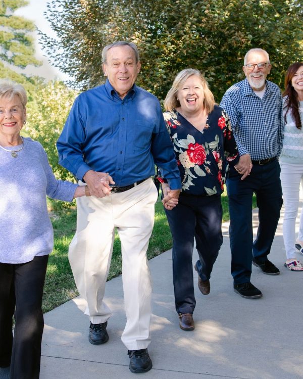 residents walking on sidewalk portrait