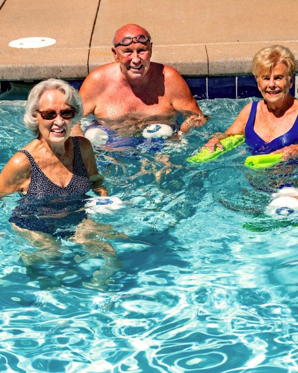 seniors working out in pool portrait